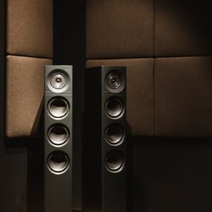black and brown speaker on black surface
