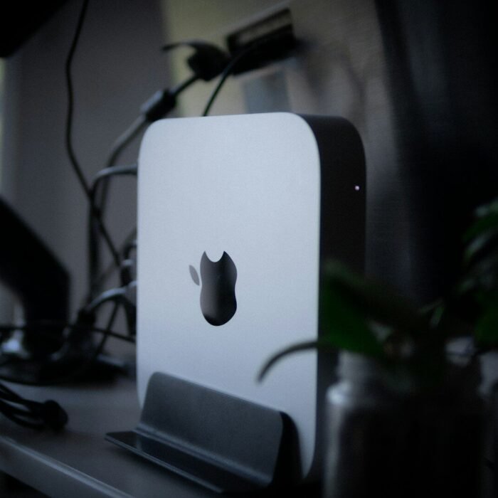 an apple computer sitting on top of a desk