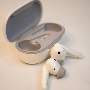 A pair of ear buds sitting on top of a table