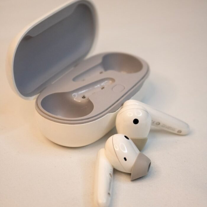 A pair of ear buds sitting on top of a table
