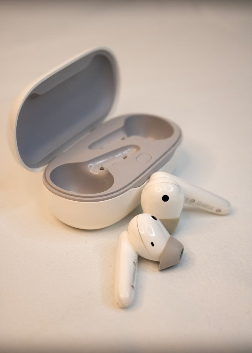 A pair of ear buds sitting on top of a table